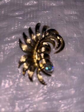 Gold Tone Floral Swirl Brooch with Iridescent Crystal